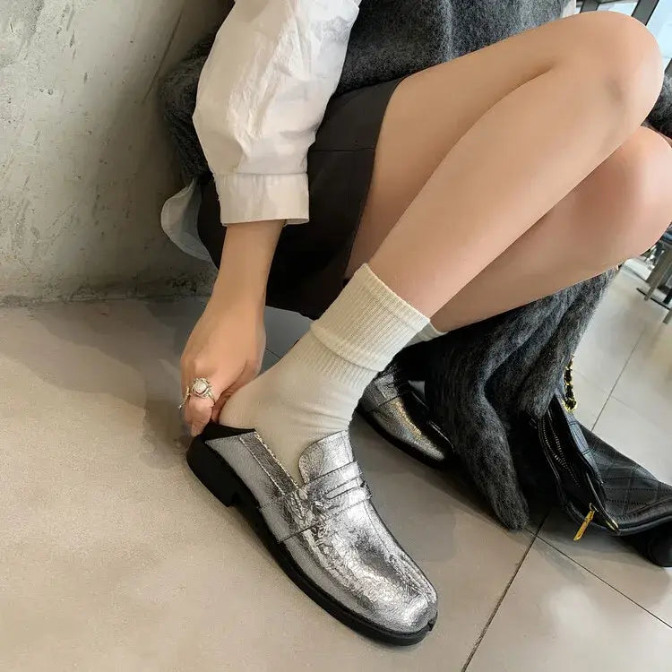 Metallic silver genuine leather split toe block loafers with stylish white socks.