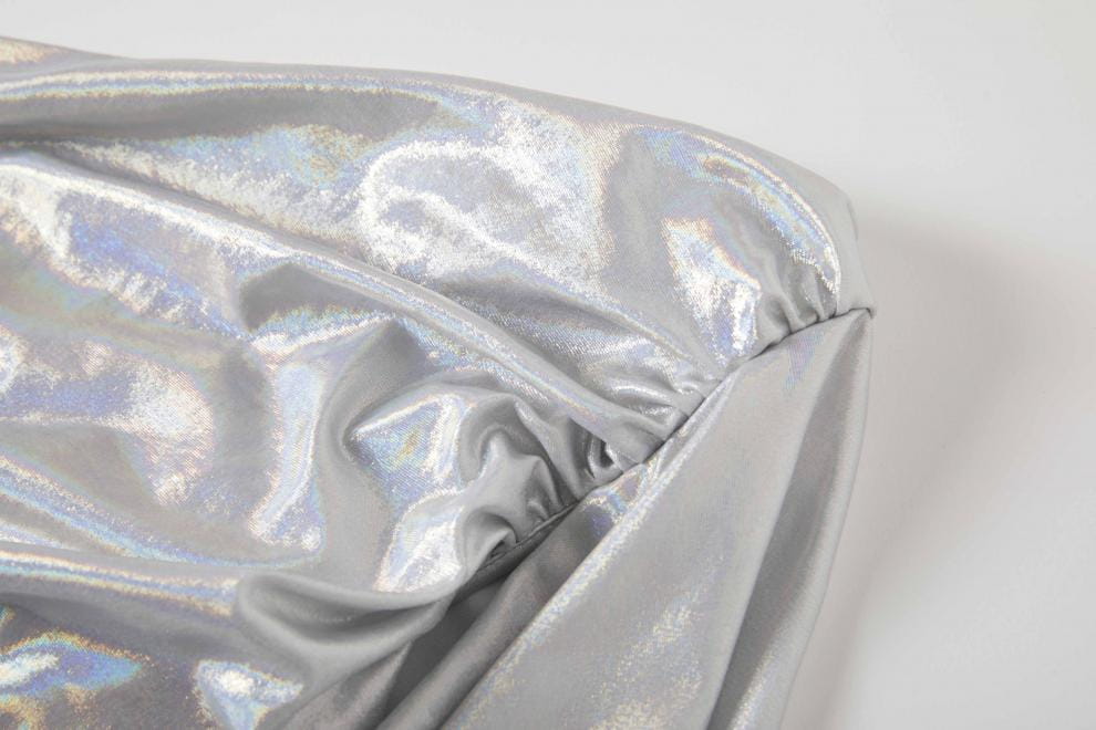 Shiny silver fabric with iridescent texture for a sexy asymmetrical design dress.