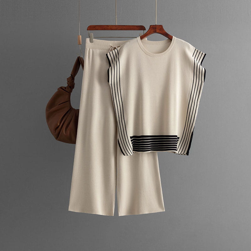 Cream-colored knit set with black stripes, round neck sleeveless top and high waist wide leg pants.