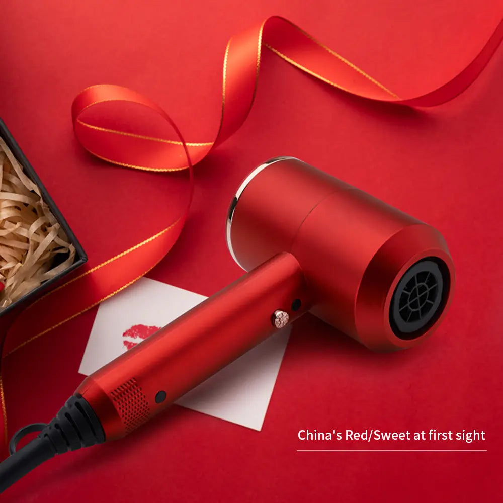 Red high power hair dryer with a metallic barrel, perfect for salon and household use.