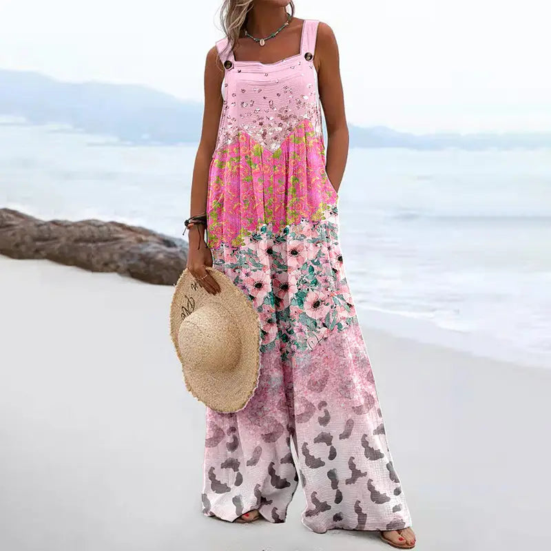 Pink floral jumpsuit with wide-leg pants and a vintage print square neck design.