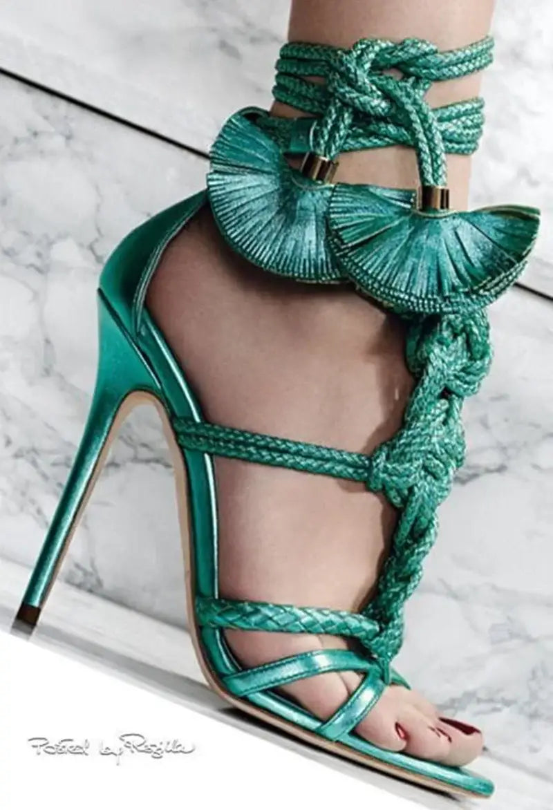 Emerald green high heel sandals with braided strap and fan tassels for stylish comfort