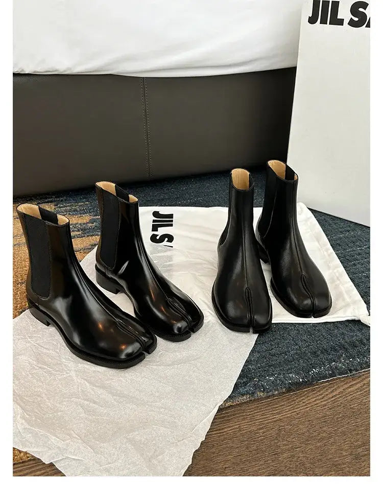 Two pairs of Women’s Retro Split Toe Ankle Boots in sleek black leather.