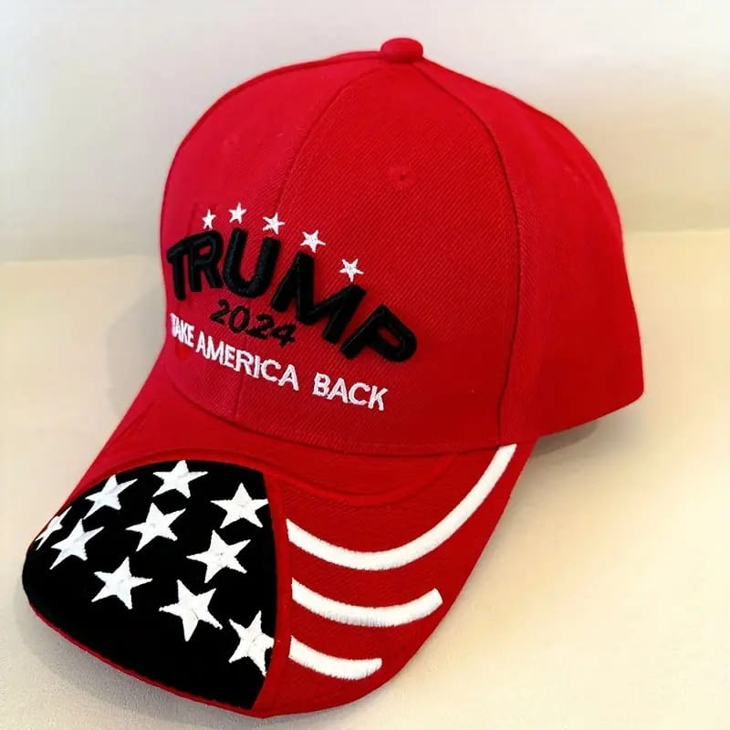 Red embroidered baseball cap with TRUMP 2024 and American flag, celebrating American values.