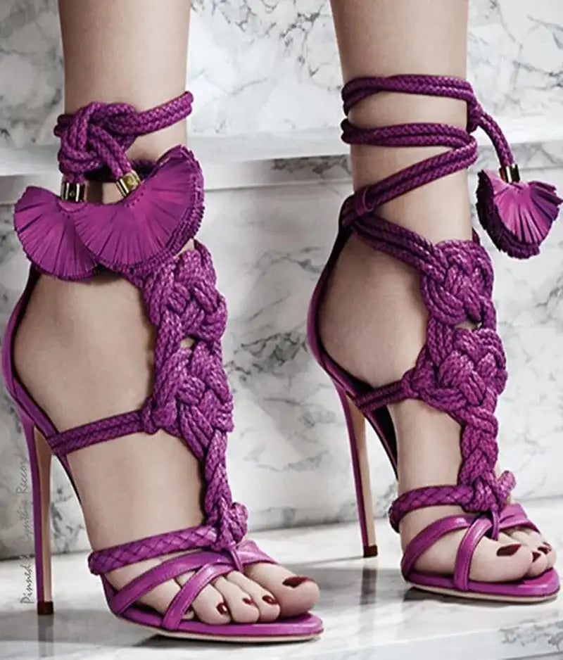 Vibrant purple braided strap high heel gladiator sandals with tassels and ruffles.