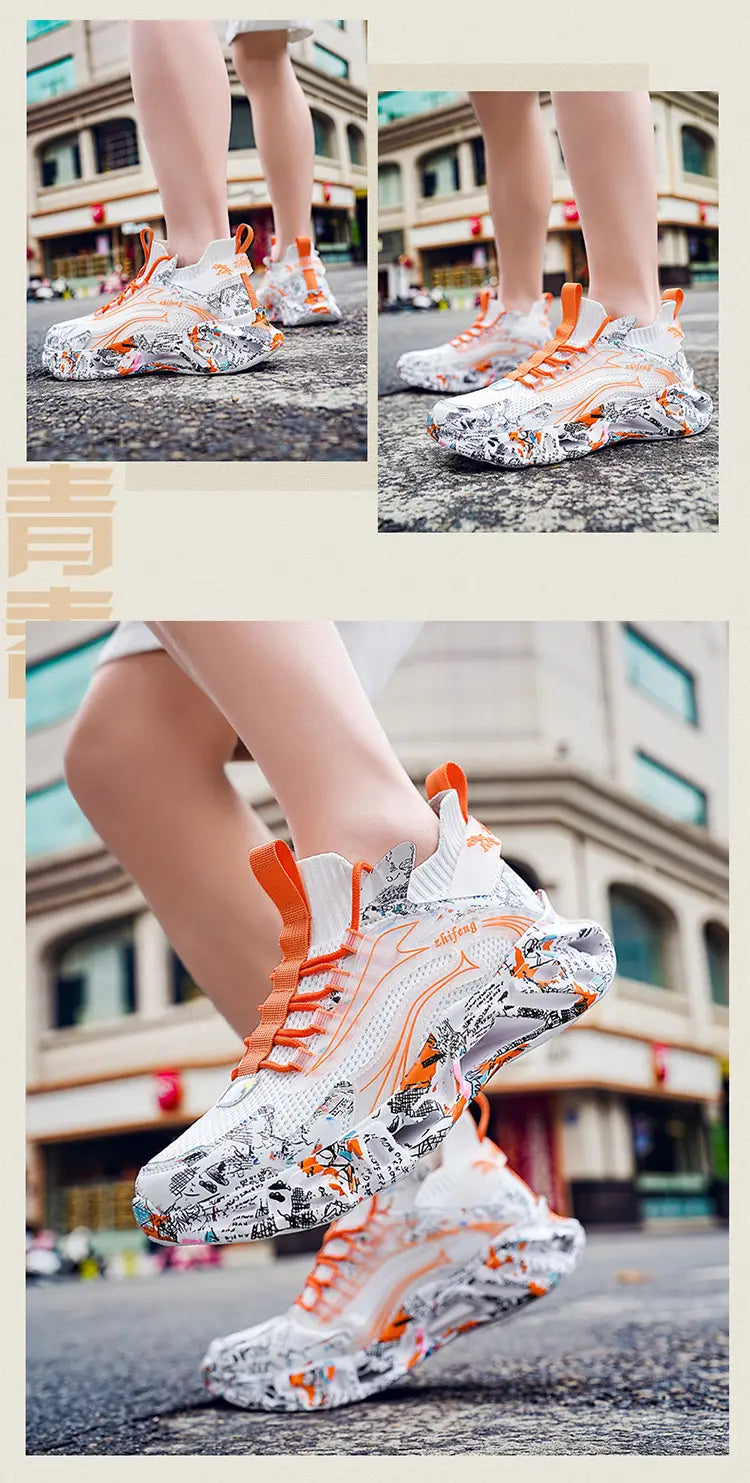 Chunky white sneakers with orange accents and graffiti for large blade shock-absorbing shoes.