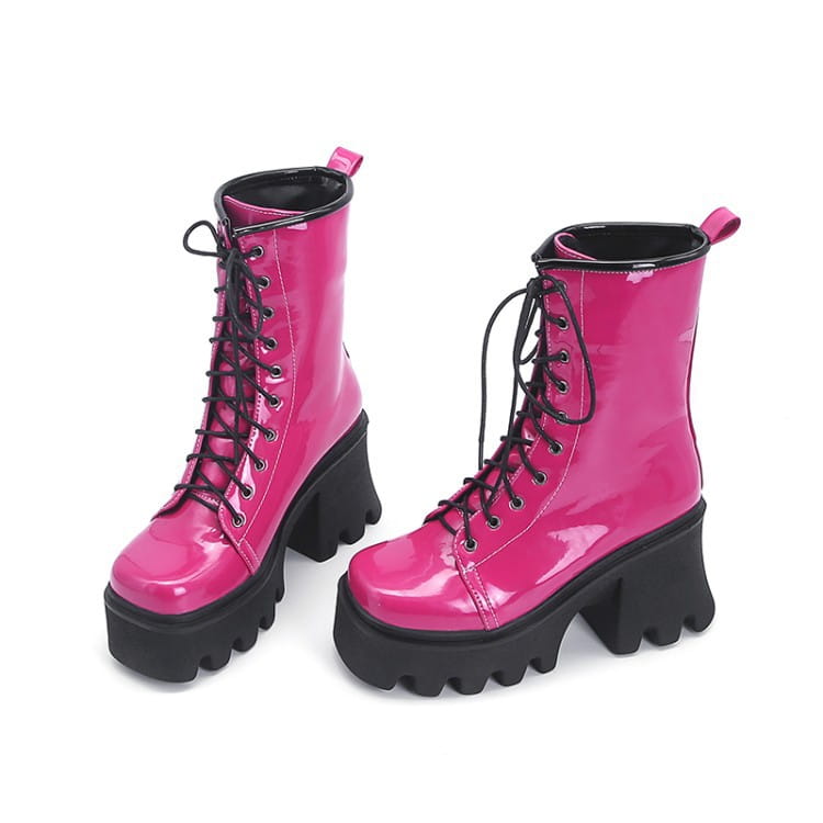 Hot pink patent boots with thick heels and black laces for a trendy style upgrade.