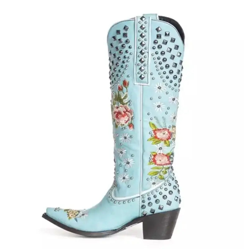 Light blue pointed toe women’s ethnic style embroidered studded cowboy boot with flowers.