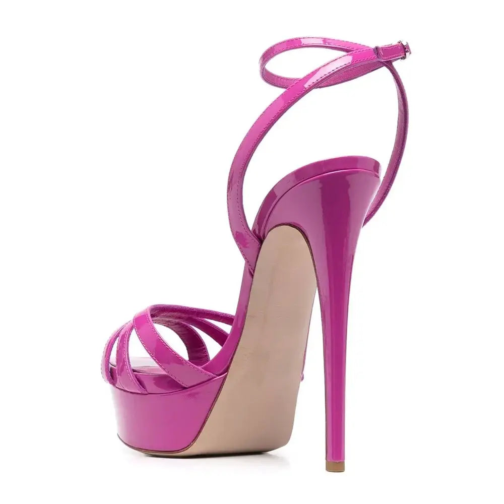 Hot pink platform sandals with ankle buckle and slim heels for a stylish look.