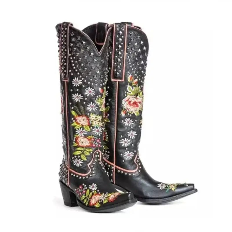 Black leather cowboy boots with floral embroidery and studs for pointed toe women’s ethnic style.