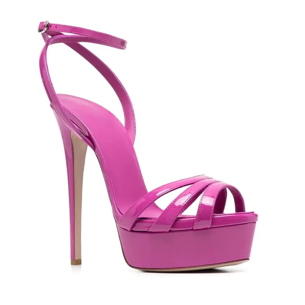 Hot pink platform sandals with ankle buckle and slim heels for a stylish look.