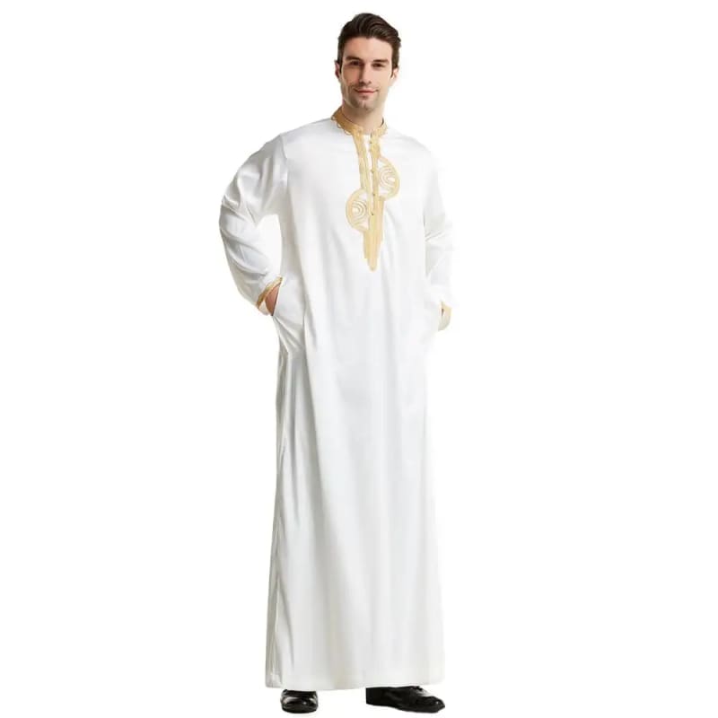 White thobe or traditional Middle Eastern robe with gold embroidery on the collar.