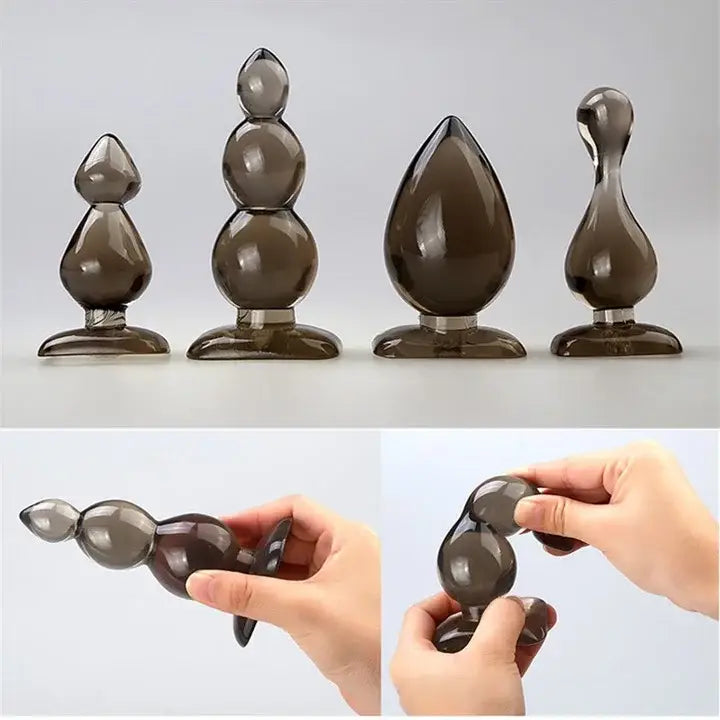 Smoky Brown Teardrop Silicone Waterproof Butt Plug in various sizes and shapes.