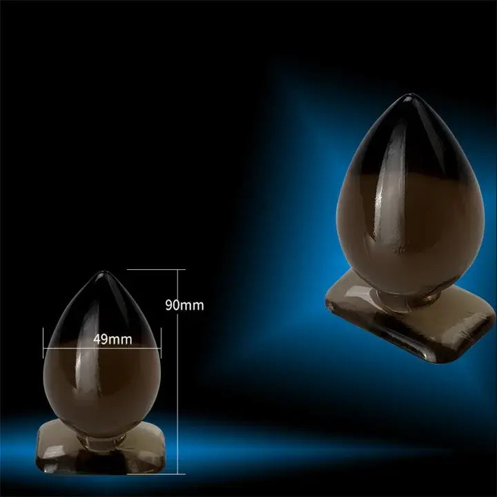 Dark brown teardrop silicone waterproof butt plug on base, perfect for size fun.