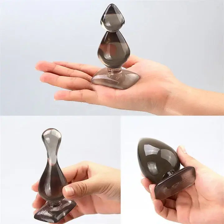 Glass or crystal perfume bottle with a decorative stopper for Smoky Brown Teardrop Butt Plug