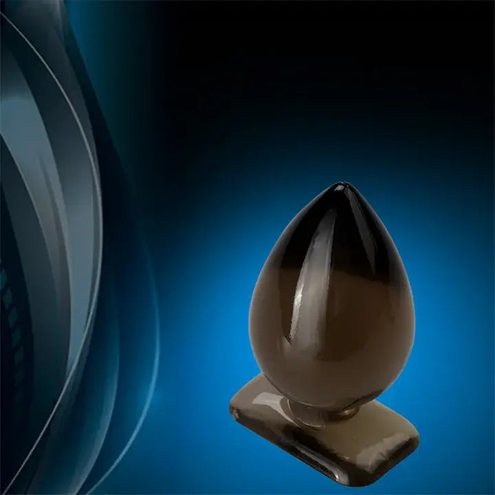 Dark brown teardrop silicone waterproof butt plug on a base, available in various sizes.