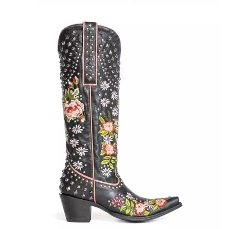 Black leather cowboy boot with floral embroidery, silver studs, and crystal accents.