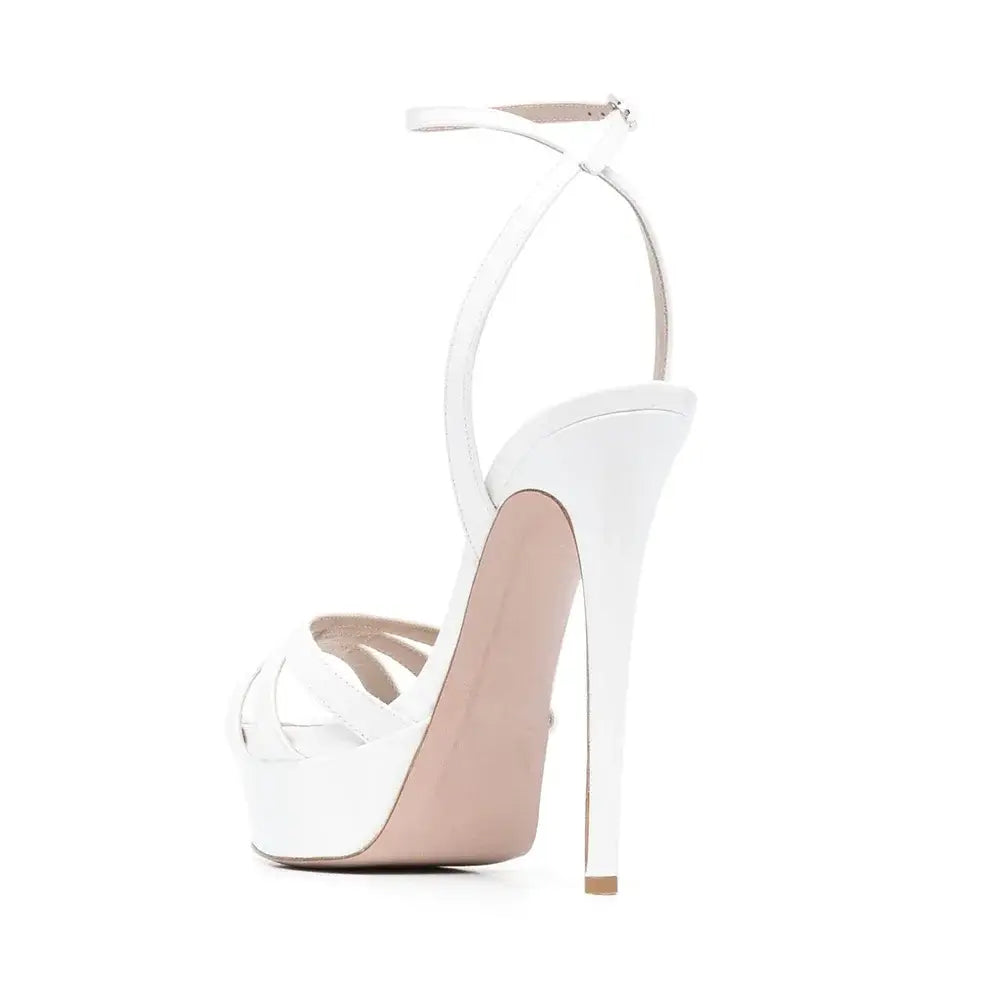 White stiletto sandal with ankle strap, perfect for styling platform sandals and slim heels.