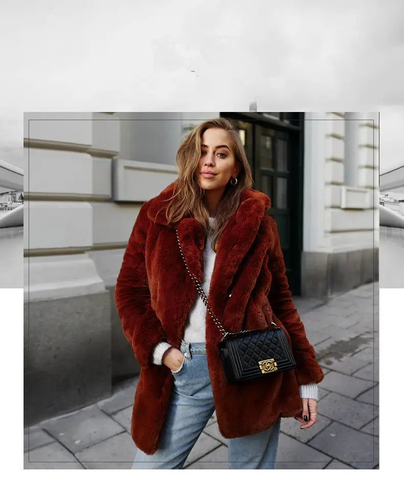 Fluffy Fur Plush Warm Coat in Wine Red styled with denim jeans and a chic bag.