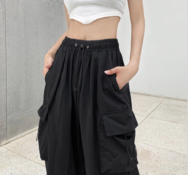 Women's black wide and baggy leg cargo pants with high waist