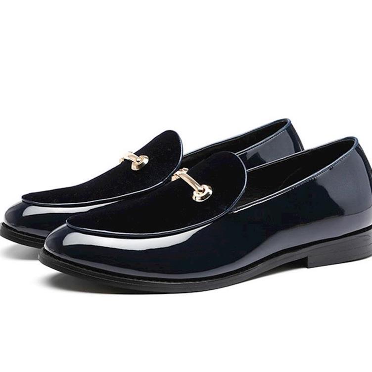 Black patent leather loafers with gold metal buckles in British style patent design.