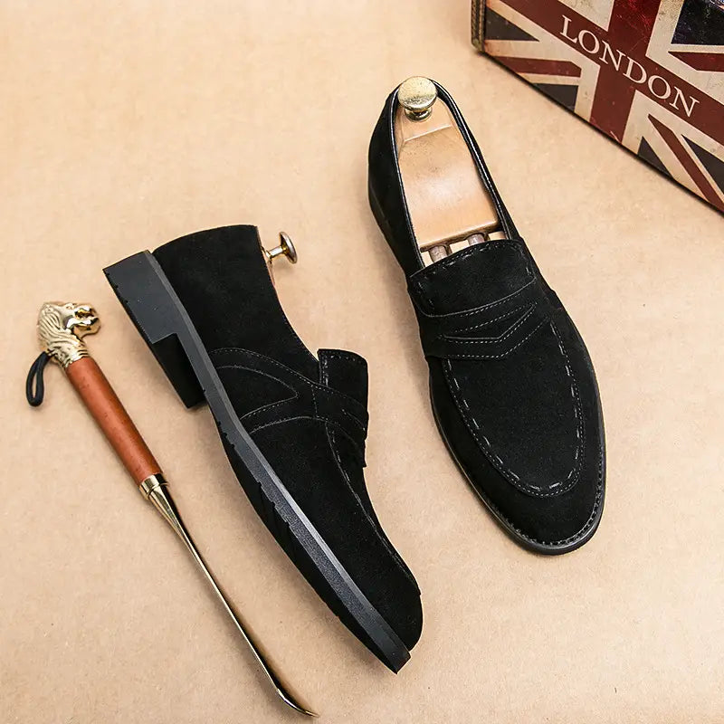 Black suede penny loafers with contrast stitching in Pointed Toe Casual style.