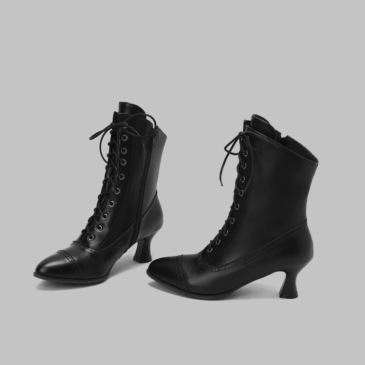 Black leather Victorian-style lace-up boots with curved heels for women’s retro steampunk look.