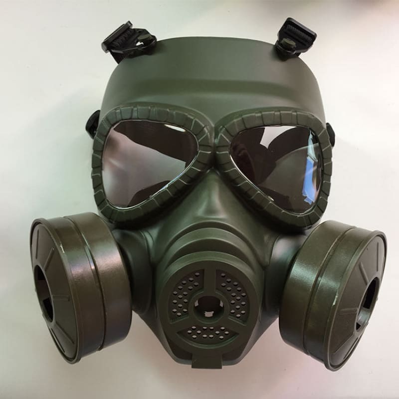 Military-style gas mask with dark green coloration and goggle-like eye protection.