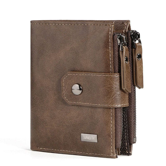 Brown leather wallet with multiple zippered compartments and a snap closure.