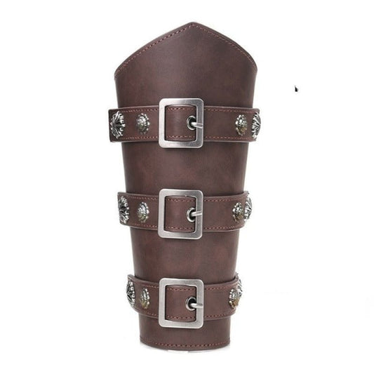 Leather bracer or gauntlet with three decorative buckled straps.