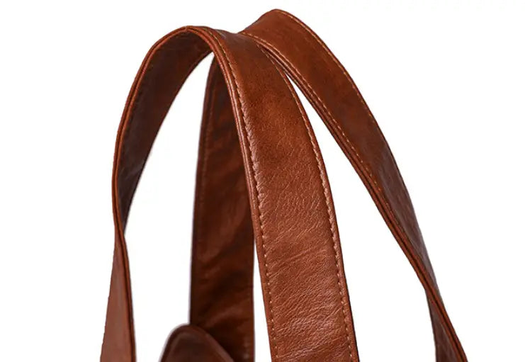 Brown leather straps on a stylish Women’s Fashion Large Capacity Handbag for elegance.