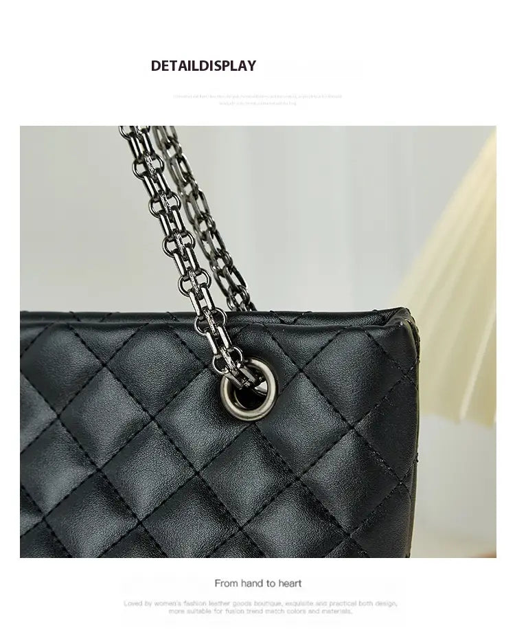 Black quilted handbag with shimmering chain strap and diamond plaid design.