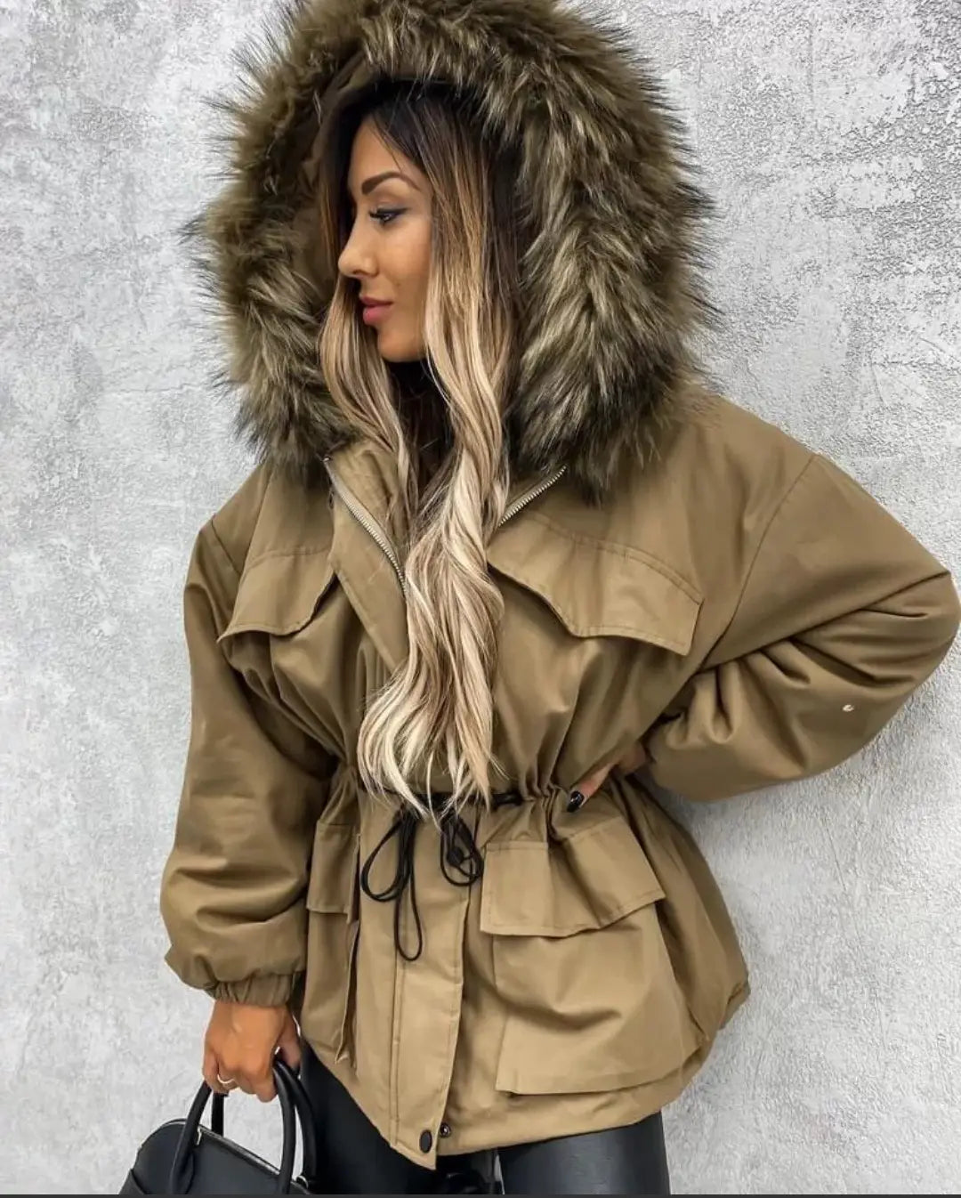 Tan parka coat with faux fur collar and belted waist for cozy winter style.