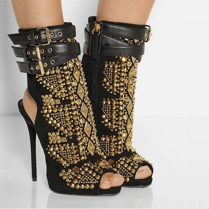 Black leather stiletto boots with gold studs, perfect for showing off a fish mouth silhouette.