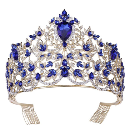 Ornate tiara adorned with blue gemstones and diamonds in an intricate floral design.