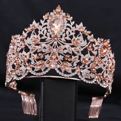 Ornate rose gold tiara adorned with intricate floral designs and gemstones.