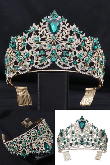 Ornate tiara featuring emerald-colored gemstones and intricate silver metalwork.