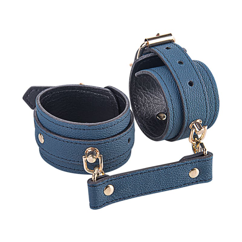 Blue leather bondage cuffs with connecting strap and metal hardware.