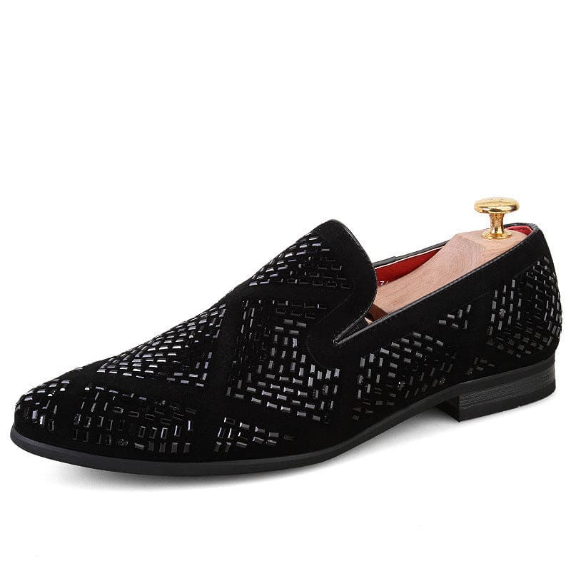 Black velvet loafer with intricate geometric cutout pattern.