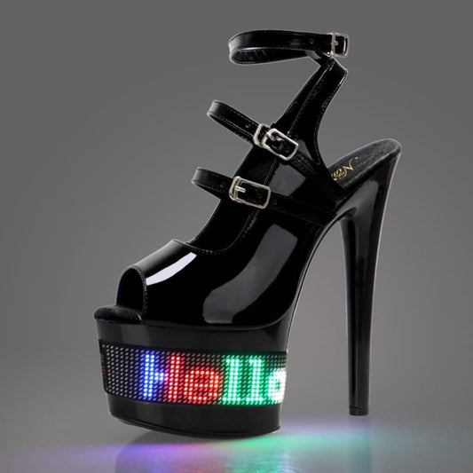 High-heeled platform sandal with illuminated LED display on the base.