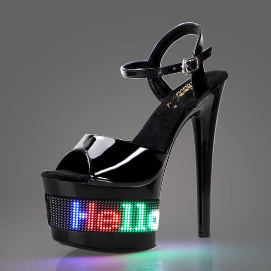 High-heeled platform sandal with a light-up LED display on the base.