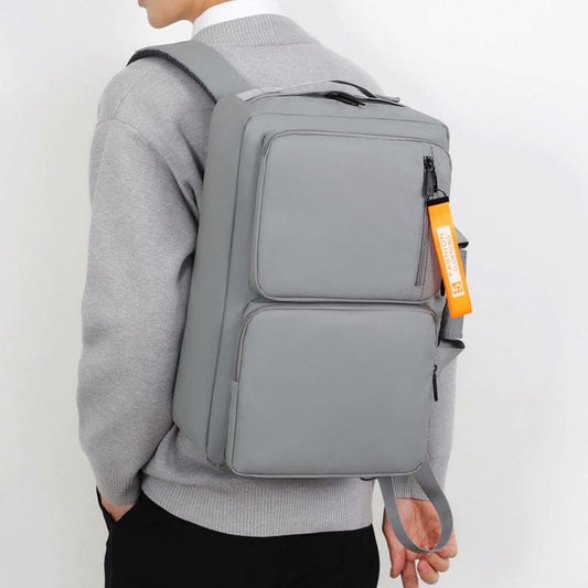 Gray backpack with multiple compartments and an orange tag.