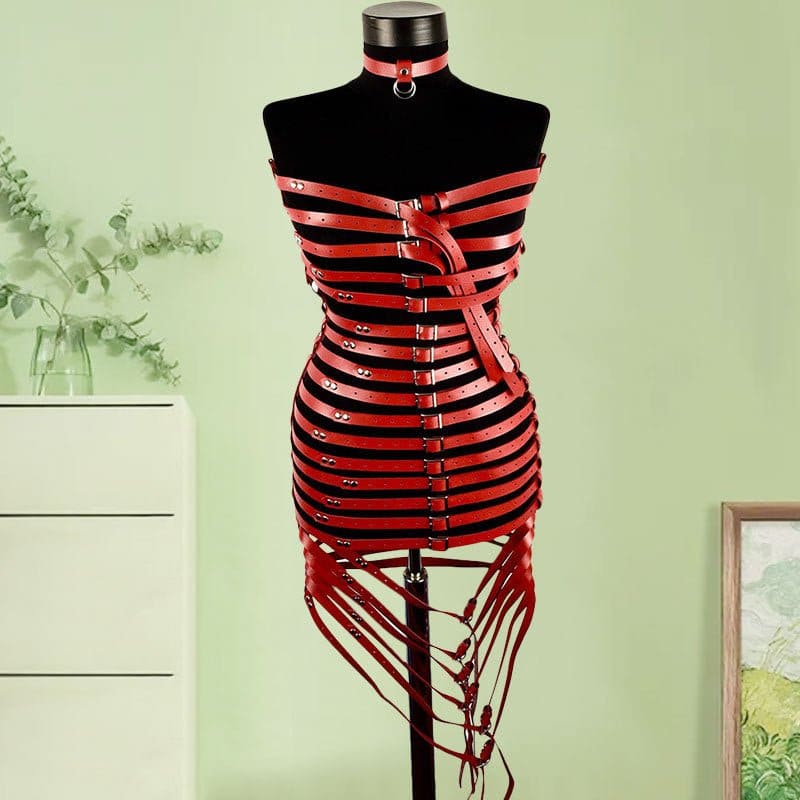 Red and black striped corset-style garment with straps and buckles displayed on a mannequin torso.