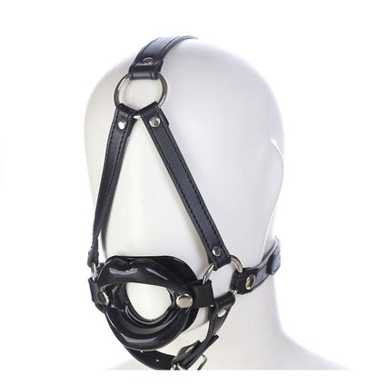 Black leather head harness with straps and metal rings.