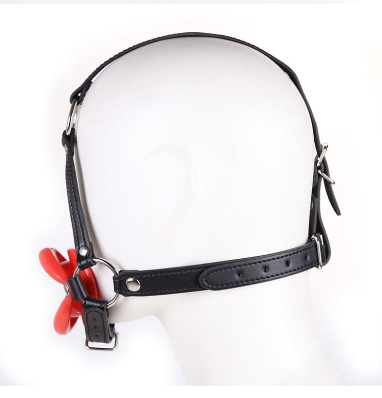 Black leather gag with a red ball or butterfly-shaped attachment.