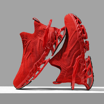 Pair of bright red athletic sneakers with a unique, futuristic design featuring a textured knit upper and sculpted sole.