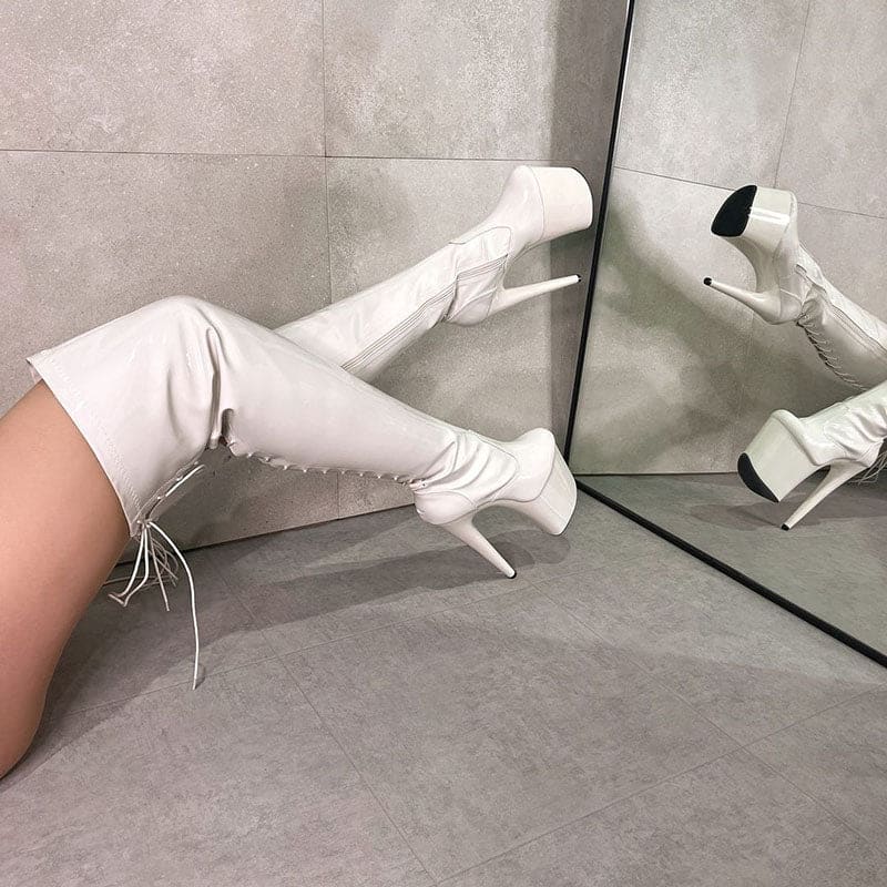 White thigh-high boots with extremely high stiletto heels.