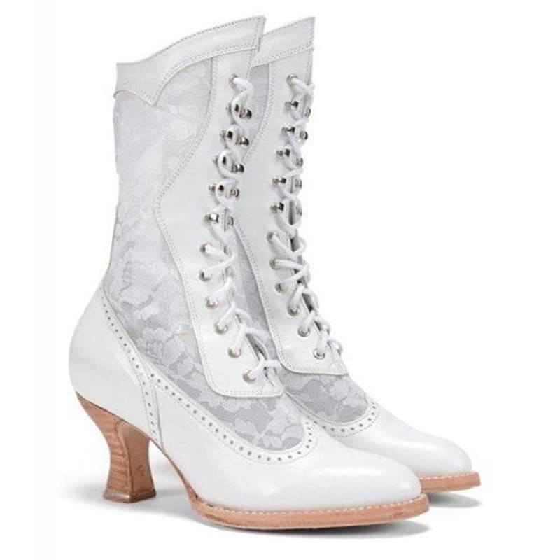 White Victorian-style lace-up boots with a curved heel and decorative perforations.