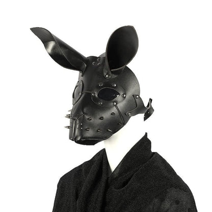 Black leather mask resembling a rabbit or dog with pointed ears and metal studs.