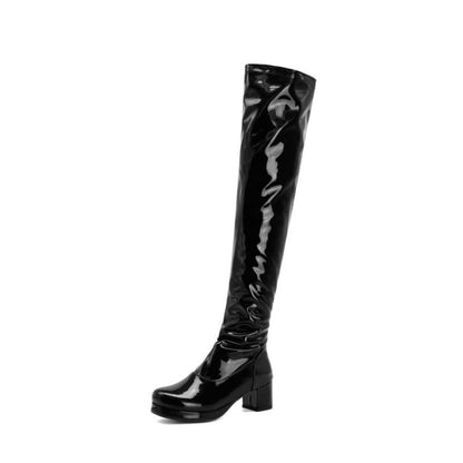 Shiny black patent leather knee-high boot with a chunky heel.